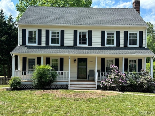 1916 Boardman Ln, Henrico, VA 23238 - colonial house featuring a chimney, a porch, and a front lawn
