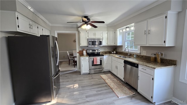 1916 Boardman Ln, Henrico, VA 23238 - kitchen with stainless steel appliances, a sink, ornamental molding, ceiling fan, and white cabinetry