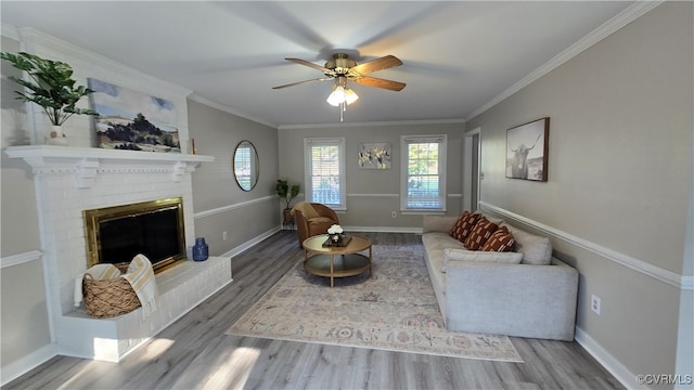 1916 Boardman Ln, Henrico, VA 23238 - living area featuring wood finished floors, ceiling fan, baseboards, crown molding, and a fireplace
