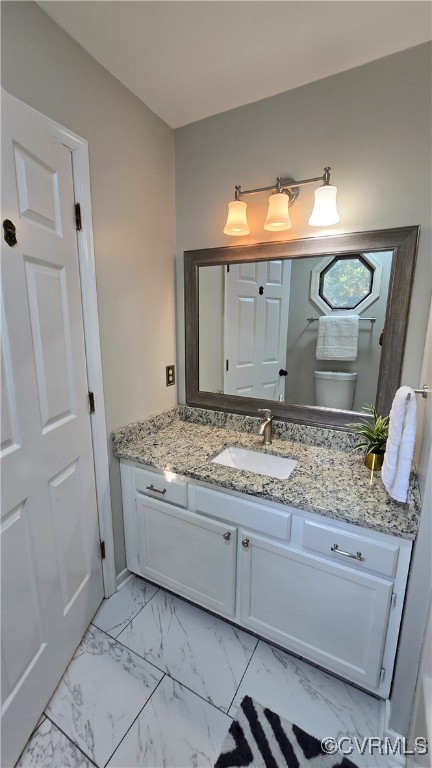 1916 Boardman Ln, Henrico, VA 23238 - bathroom featuring vanity, marble look tiles, and toilet