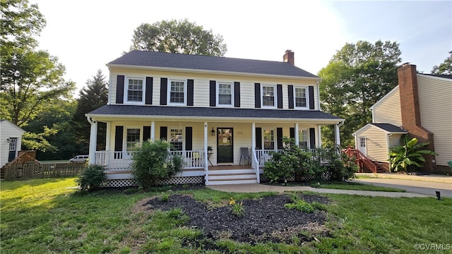 1916 Boardman Ln, Henrico, VA 23238 - colonial house with covered porch, a front yard, and a chimney