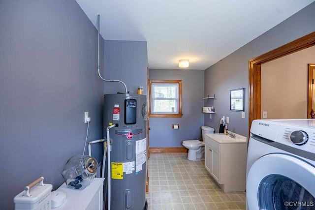 400 E California Ave, Crewe, VA 23930 - clothes washing area with laundry area, washer / dryer, baseboards, light floors, and water heater