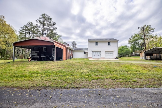 400 E California Ave, Crewe, VA 23930 - exterior space featuring a garage, a carport, a yard, and driveway