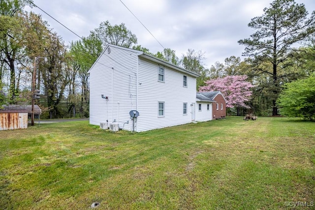 400 E California Ave, Crewe, VA 23930 - back of house with a storage unit, an outbuilding, and a yard