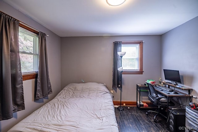 400 E California Ave, Crewe, VA 23930 - bedroom featuring baseboards, multiple windows, and wood finished floors