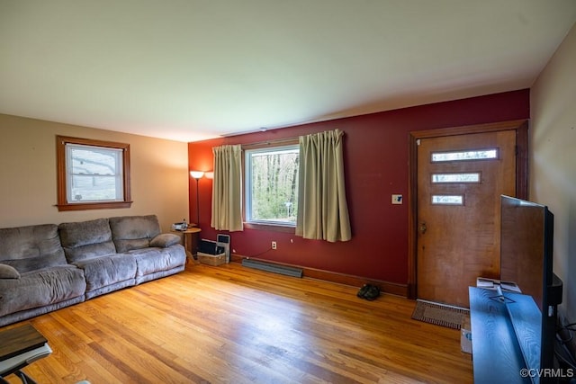 400 E California Ave, Crewe, VA 23930 - living room featuring wood finished floors and a baseboard radiator