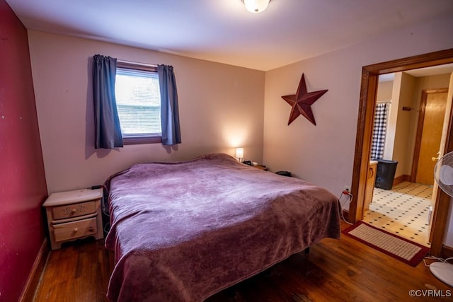 400 E California Ave, Crewe, VA 23930 - bedroom with baseboards and wood finished floors