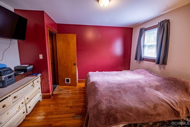 400 E California Ave, Crewe, VA 23930 - bedroom featuring baseboards and wood finished floors