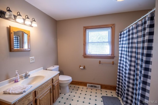 400 E California Ave, Crewe, VA 23930 - full bathroom with vanity, toilet, tile patterned floors, baseboards, and visible vents