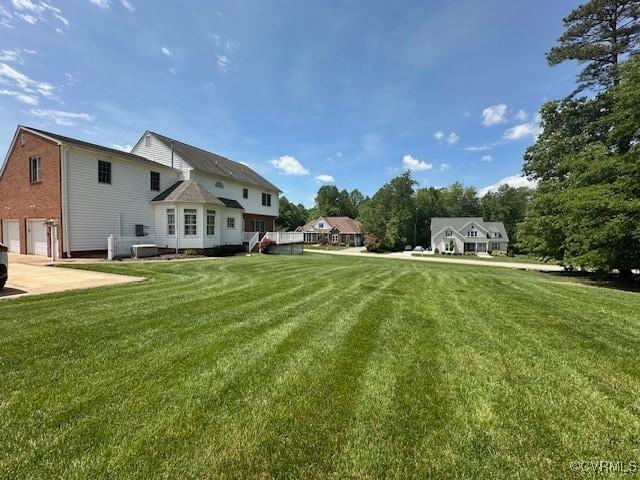view of yard featuring a garage