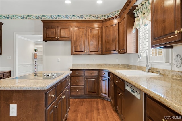 kitchen with dishwasher, a sink, black electric stovetop, recessed lighting, and dark wood-type flooring