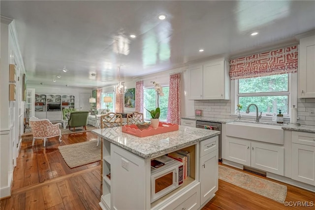 kitchen with dishwasher, a sink, open shelves, backsplash, and recessed lighting