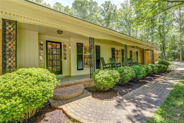 view of exterior entry featuring a porch