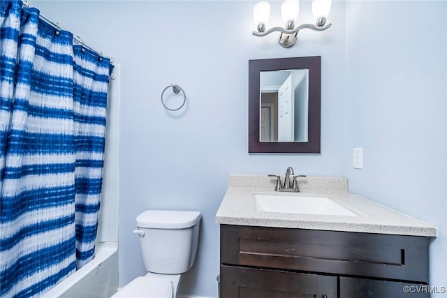 bathroom with vanity, shower / bath combo, and toilet
