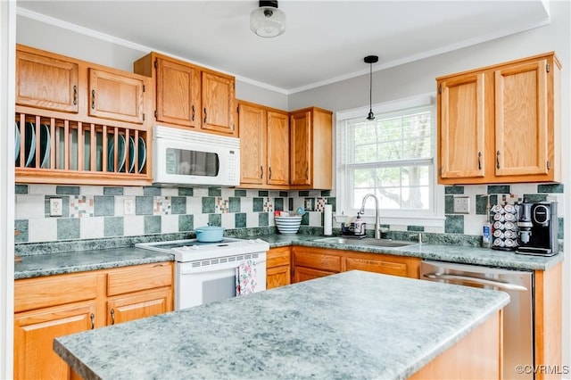 kitchen with backsplash, white appliances, ornamental molding, and a sink