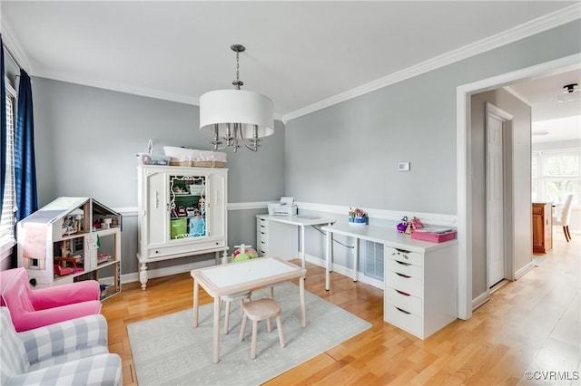 interior space featuring crown molding, light wood-type flooring, and a chandelier