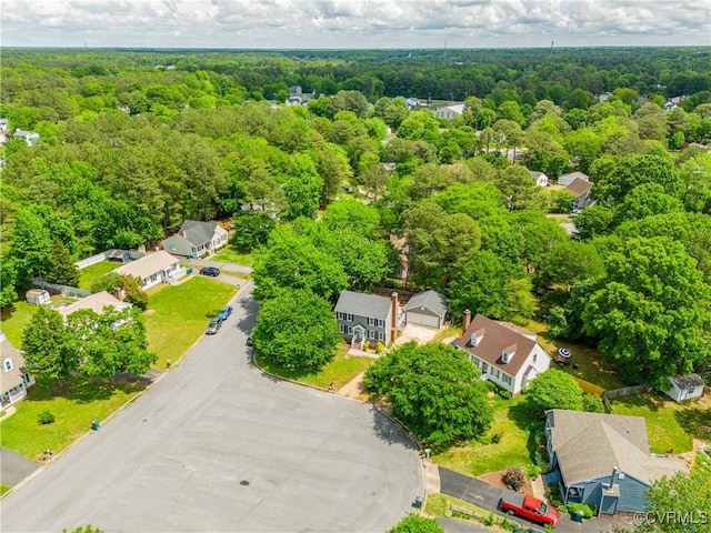 drone / aerial view with a view of trees and a residential view