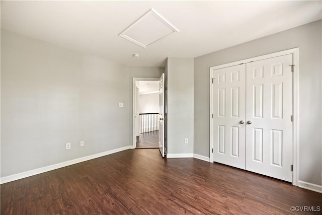 3713 Spratling Way, Chesterfield, VA 23237 - unfurnished bedroom featuring baseboards, attic access, dark wood finished floors, and a closet