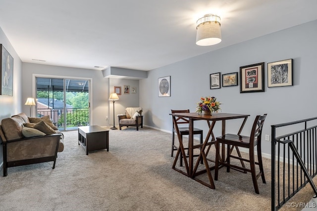 dining area with carpet flooring and baseboards