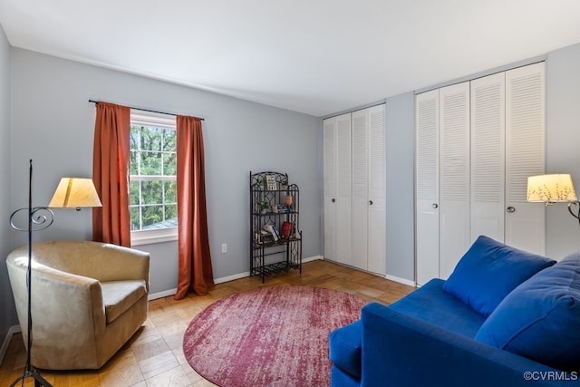 living area featuring baseboards