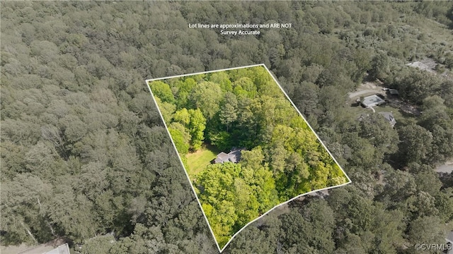 bird's eye view featuring a forest view
