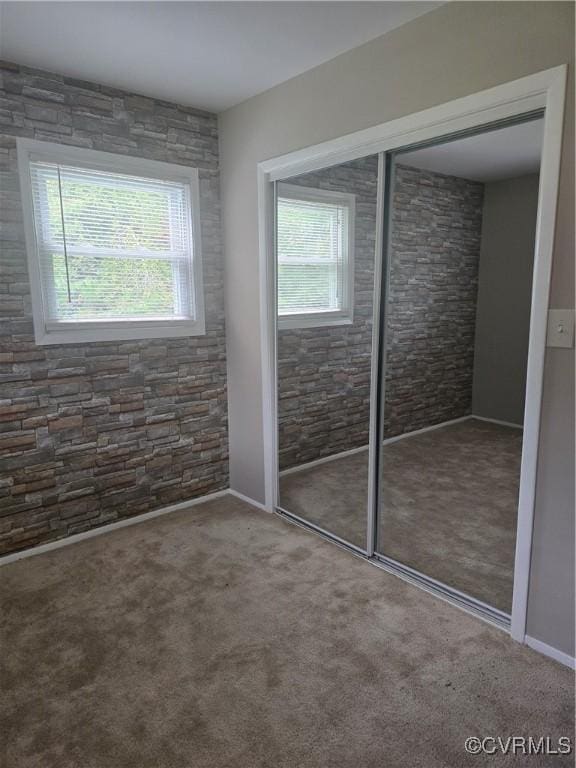 2503 Glendale Ave, Petersburg, VA 23805 - unfurnished bedroom featuring a closet and carpet flooring