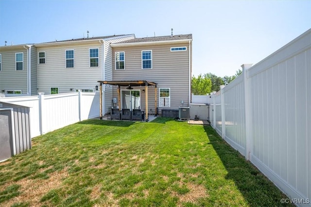 rear view of property with a lawn, central AC unit, a fenced backyard, and a pergola