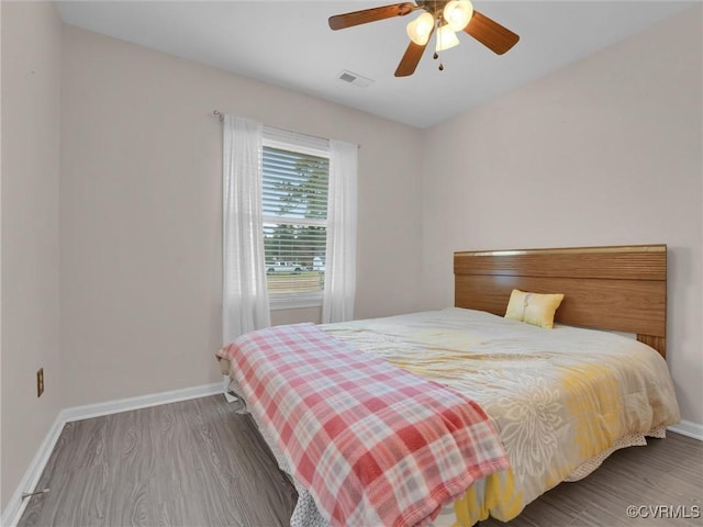239 Marine Dr, Dunnsville, VA 22454 - bedroom featuring wood finished floors, baseboards, and a ceiling fan