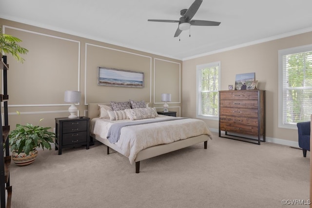 bedroom with baseboards, ornamental molding, a ceiling fan, and carpet flooring