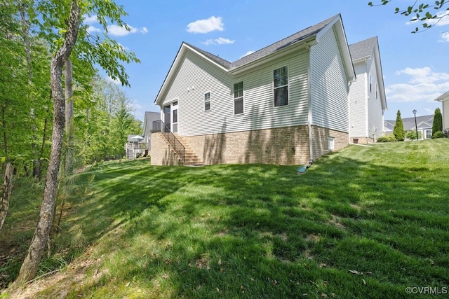 rear view of property featuring stairs and a yard