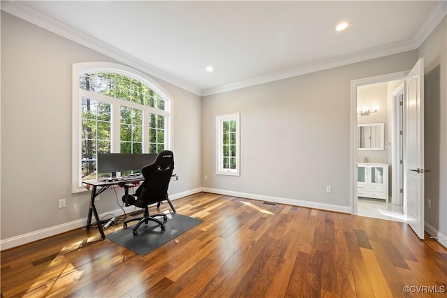 home office featuring crown molding, baseboards, recessed lighting, and wood finished floors
