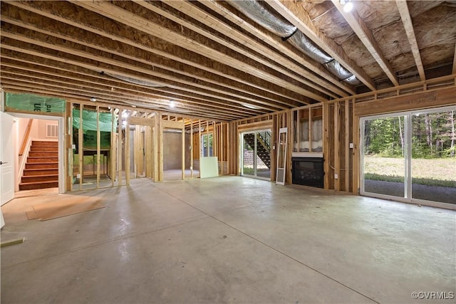 interior space with stairs and concrete flooring