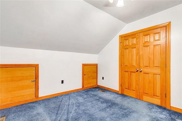 additional living space with ceiling fan, visible vents, baseboards, lofted ceiling, and carpet