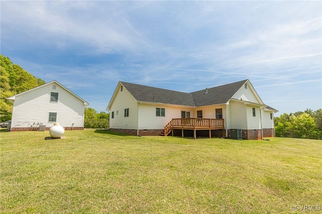 rear view of house featuring central AC, a lawn, a wooden deck, and crawl space