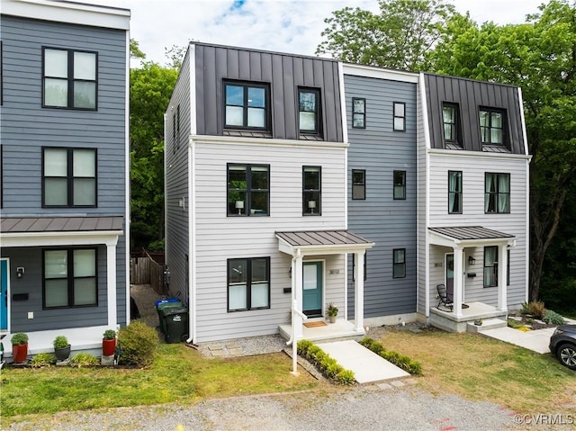 3010 E Franklin St, Richmond, VA 23223 - view of property with a standing seam roof and a metal roof