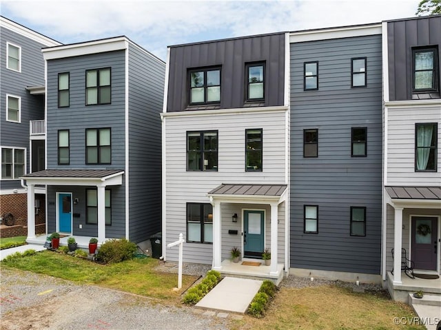 townhome / multi-family property featuring metal roof and a standing seam roof