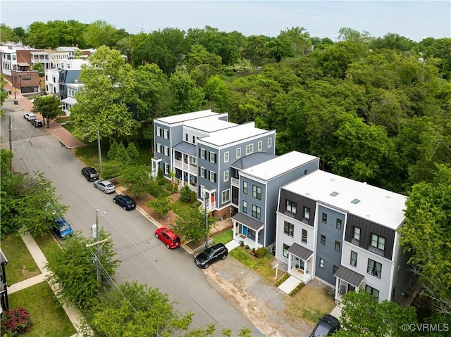 birds eye view of property with a wooded view