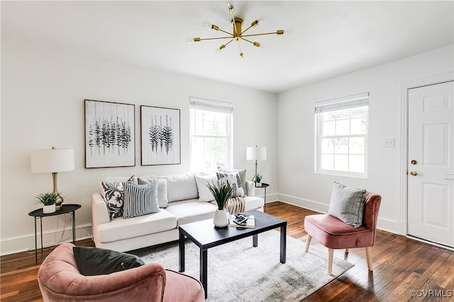 living room with baseboards, wood finished floors, and a healthy amount of sunlight