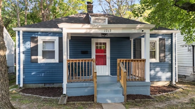 1712 Halifax Ave, Richmond, VA 23224 - view of front of property with a shingled roof, covered porch, a chimney, and crawl space