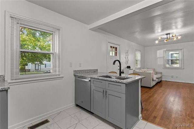 1712 Halifax Ave, Richmond, VA 23224 - kitchen featuring visible vents, a peninsula, gray cabinets, a sink, and dishwasher