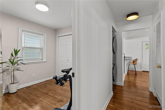 1712 Halifax Ave, Richmond, VA 23224 - hallway with wood finished floors, baseboards, and stacked washer / drying machine