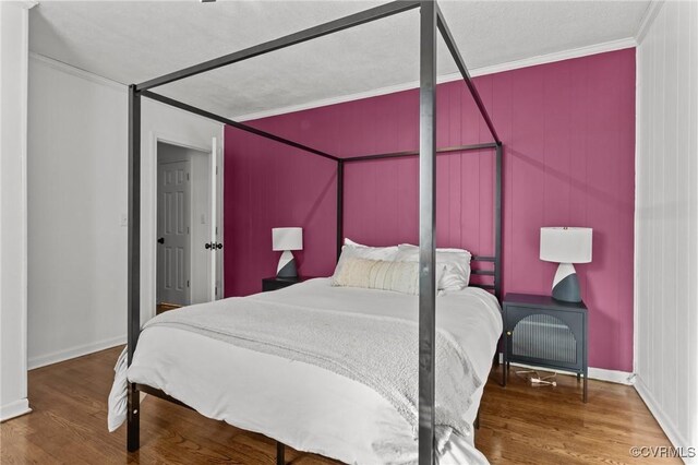 1712 Halifax Ave, Richmond, VA 23224 - bedroom featuring baseboards, ornamental molding, and wood finished floors