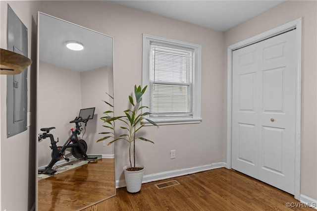 1712 Halifax Ave, Richmond, VA 23224 - workout area featuring baseboards, visible vents, and wood finished floors