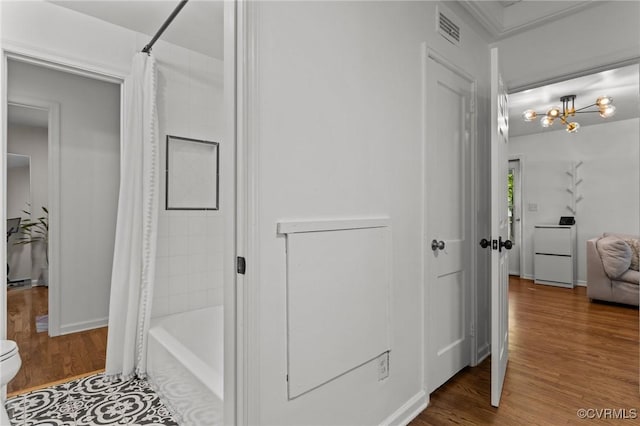 1712 Halifax Ave, Richmond, VA 23224 - full bathroom with shower / bath combination with curtain, toilet, wood finished floors, and visible vents