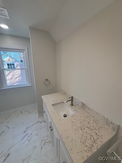 bathroom featuring baseboards, visible vents, marble finish floor, and vanity