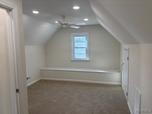 additional living space featuring a ceiling fan, baseboards, lofted ceiling, carpet flooring, and recessed lighting