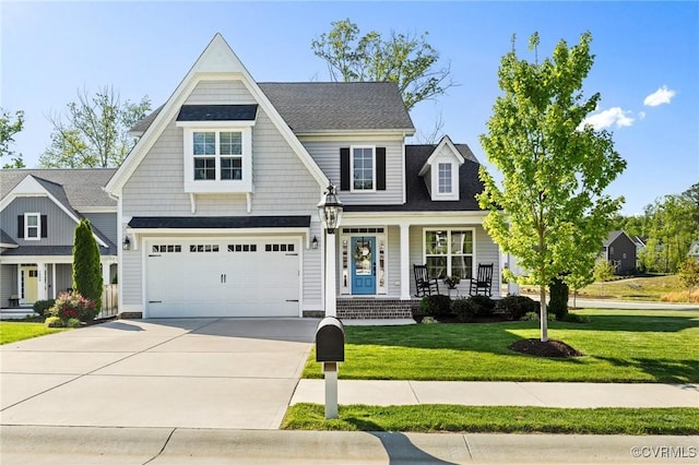 craftsman-style house featuring a porch, a garage, a front lawn, and driveway