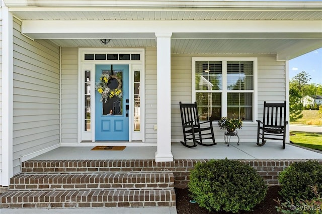 entrance to property with a porch