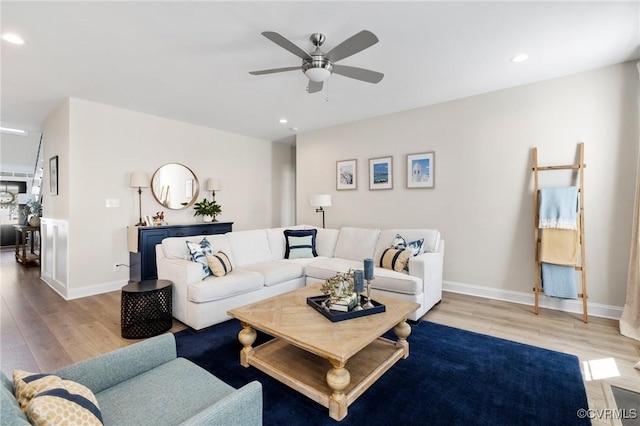 living room with ceiling fan, recessed lighting, and wood finished floors