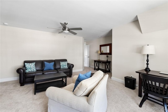 living room featuring baseboards, ceiling fan, and light carpet